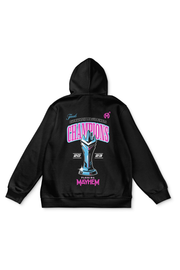 A black pullover hoodie with a design celebrating the "Finals Overwatch League Finals." It features the word "CHAMPIONS," a blue and teal trophy illustration, and the years 2023 At the bottom, "Florida Mayhem" is printed in pink with the team's logo. The hoodie has ribbed cuffs and waistband.