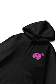 Close-up of a black hoodie featuring a pink Florida Mayhem logo with a bomb design on the left chest area, with visible drawstrings and stitching details.